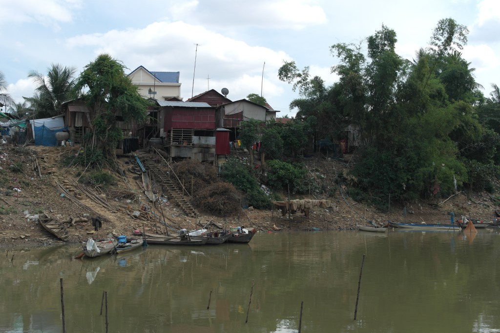 dirty riverside in cambodia